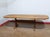 This Mid Century Modern Vintage Teak and Danish extending dining table by Ansager exemplifies the impeccable craftsmanship...