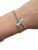 A delicate design by Tiffany & Co., celebrating nature’s elegance. The bracelet features a fine platinum cable link chain,...