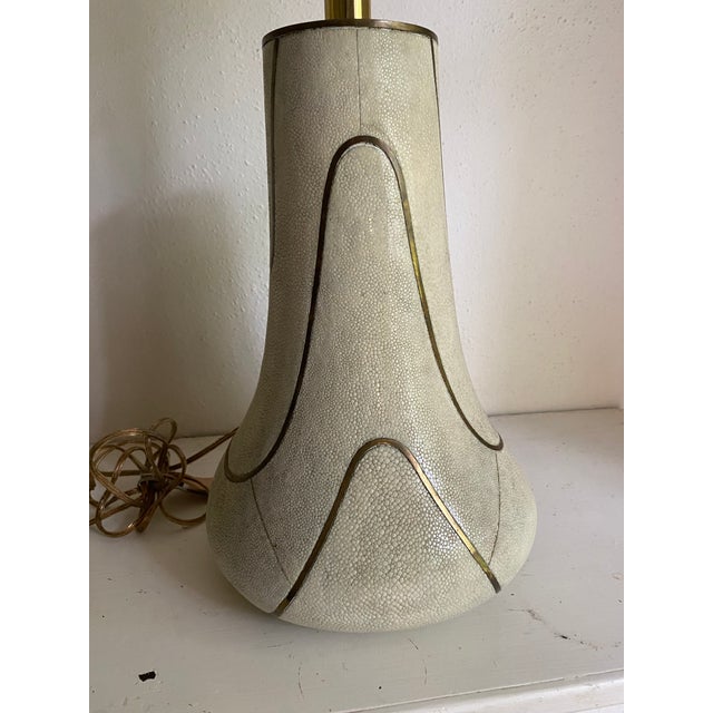 Exquisite hand made lamp with natural shagreen in various shades of off-white, the swirling segments with bronze...