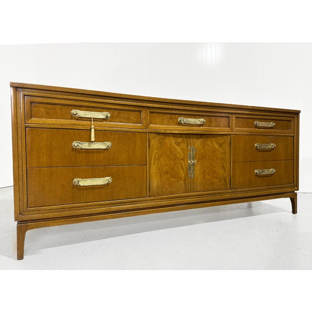 This is an outstanding solid wood Mid Century Modern Style Dresser or Credenza 78". The exterior features 7 drawers with...