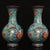 This is a striking and vibrant pair of matching cloisonné enamel vases. Featuring a classic, globe-shaped body with a...