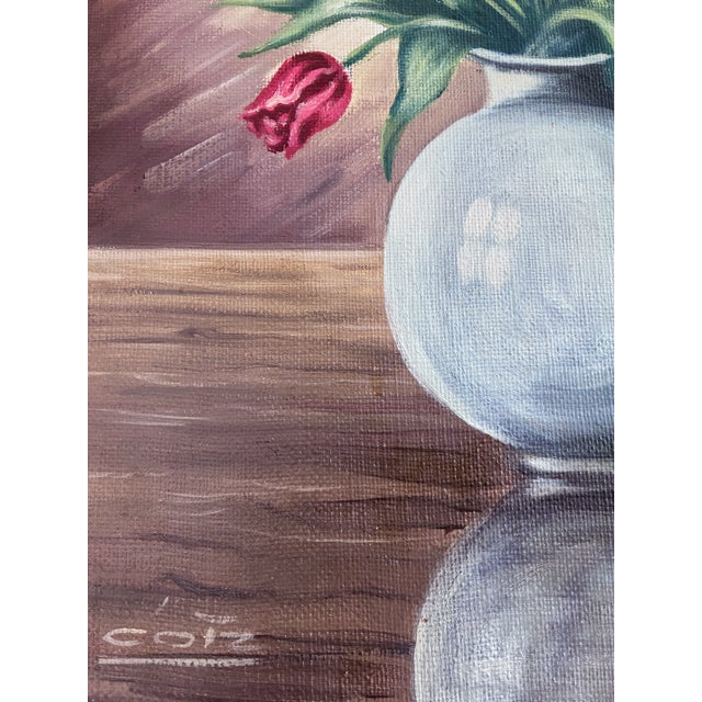 This vintage original oil painting, painted around the 1960s, shows a colourful bouquet of tulips in a pale ceramic vase....