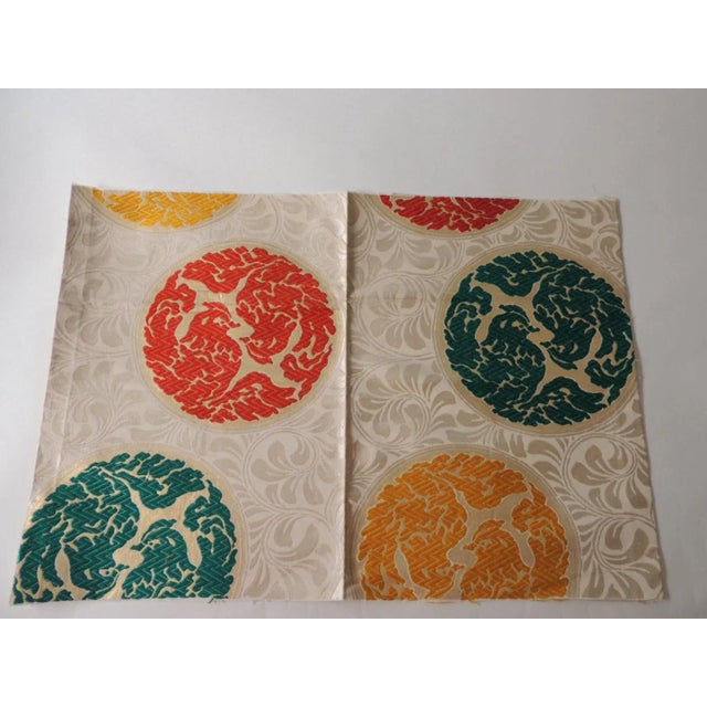 Vintage orange and green silk obi textile with medallions fragment. Tone and tone woven floral with embroidered birds and...