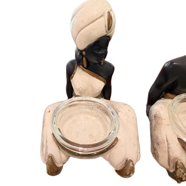 1950s Mid-Century Chalkware Blackamoor Figurines & Ashtrays with Glass Inserts - A Pair Period: 1950s Styles: Mid-Century...