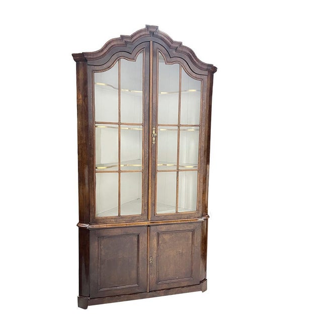 Dutch large corner display cabinet, ca 1780-1800 A beautiful corner cabinet with a top section with 2 glass doors to...