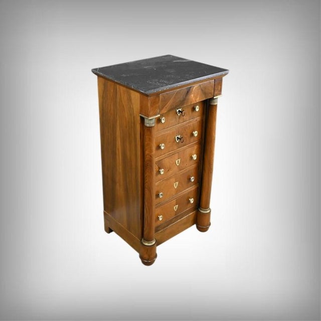 This Empire-style walnut living room cabinet is distinguished by its refined appearance and superb gray marble top, which...