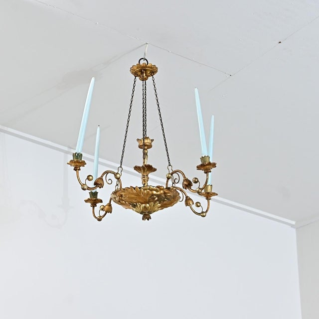 German 19th century giltwood chandelier for burning taper candles, untouched by the modern convenience of electricity as a...