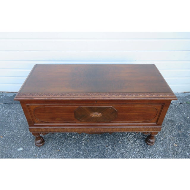 This brilliant Cedar Trunk Chest is made of wood, solid wood, walnut veneer, and cedar wood. The Chest was made by Caswell...