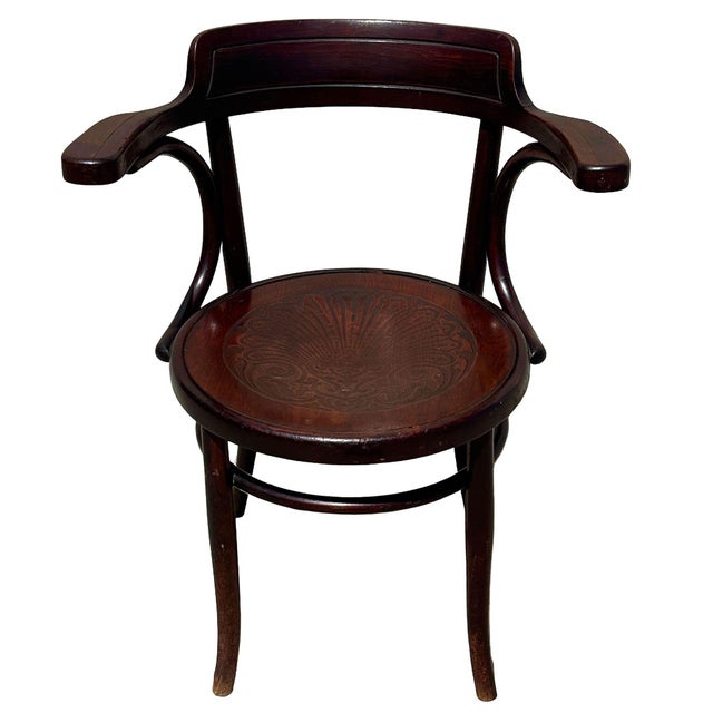 Turn of the 19th century bentwood armchair was manufactured by the renowned Fischel company, a premier Central European...