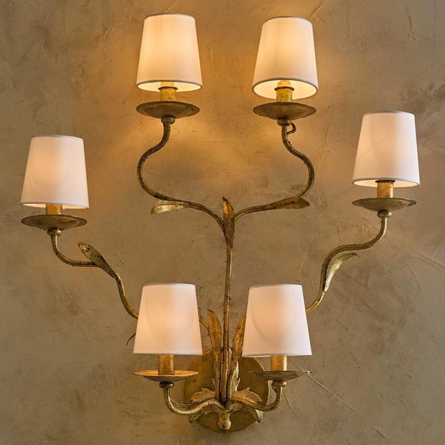 An Italian gilt leaf wall sconce from the 1960s, where craftsmanship meets the natural grace of botanical form. Rising...