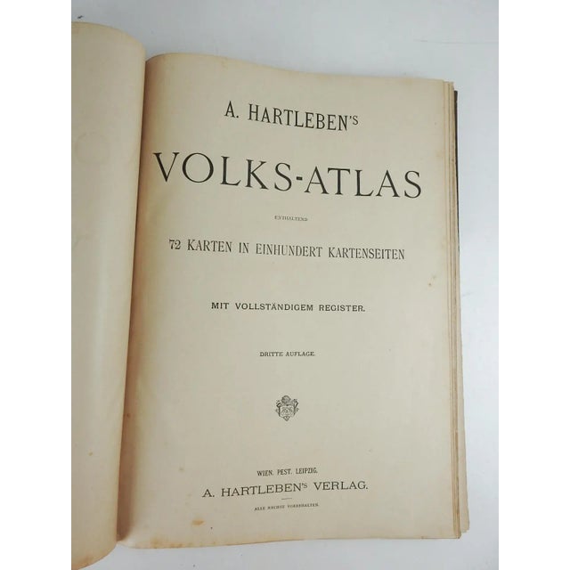 Antique circa 1900 A. Hartleben's Volks-Atlas. Published by A. Hartleben's, Germany. Folio hardcover with decorated olive...