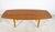 A classic Knoll coffee table in highly figured walnut with birch tenons and legs, designed by Abel Sorensen, ca. 1950s.