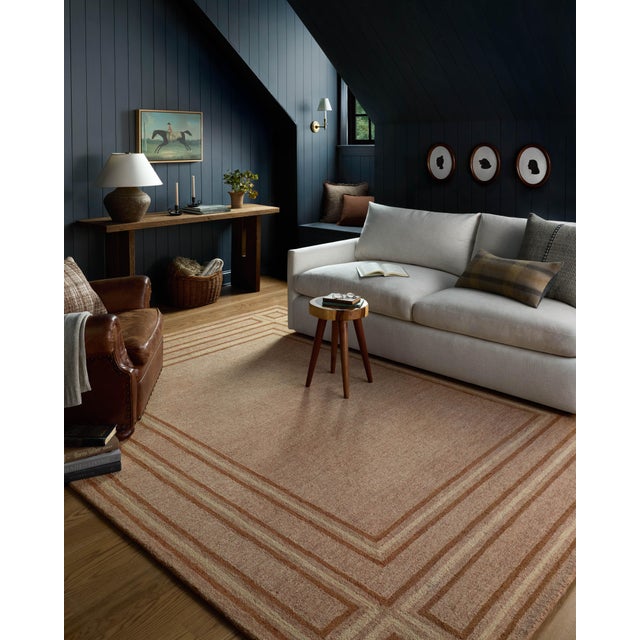 The Alfie Collection from Chris Loves Julia x Loloi is a handmade area rug with a playful framed design, a modern update...