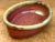 Hand-thrown with rich artisanal texture and traditional earth tones, this vintage studio pottery oval vessel features a...
