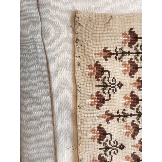 Vintage hand-embroidered textile. Features a dense, all-over stylized botanical block design stitched onto a natural...