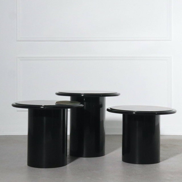 Set of three Milano Memphis style pedestal style nesting tables in ebonized lacquer with abstract painted tops. Circa...