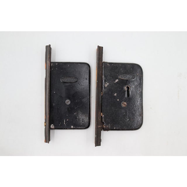Vintage pocket door mortise locks with a japanned finish. No key is included. Made by Brandford. The original mounting...