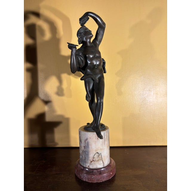 Early 19th century Italian Grand tour patinated bronze figure of dancing men with cymbals, raised on breche violet and...