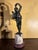 Early 19th century Italian Grand tour patinated bronze figure of dancing men with cymbals, raised on breche violet and...