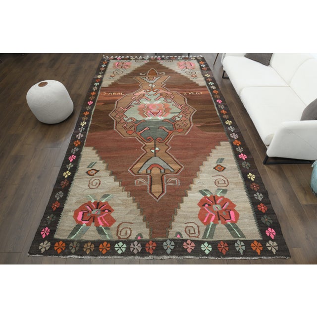 Vintage Turkish Hand-Knotted vintage rug is a semi-antique vintage area rug.'70s Eastern region of Turkey's unique rug is...