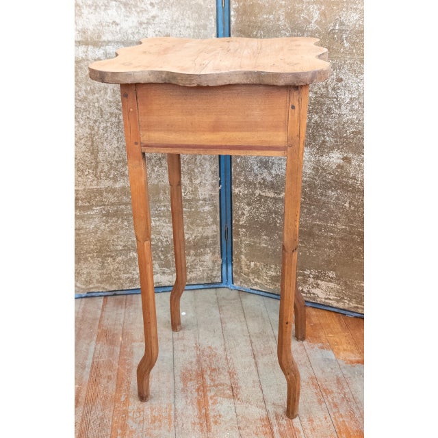 We are selling this unusual accent side table or work stand. The stand has Shaker qualities but very unusual cabriole...