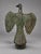 A cast patinated bronze eagle sculpture, unmarked, likely 20th century, modeled with wings held open and the head turned...