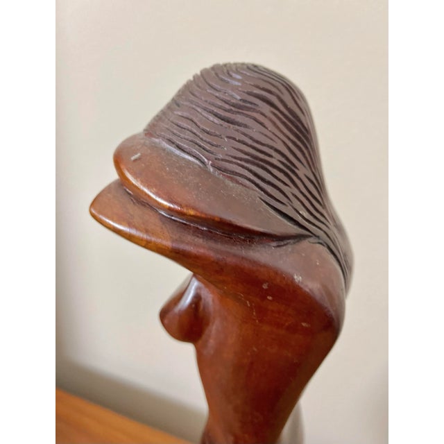 Carved Figure Sculpture in the style of F. Simeon. A tall and narrow carving of a female with her head in her arms....