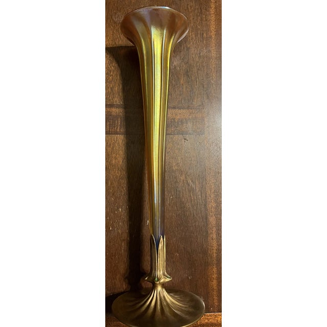 A magnificent and monumental Art Nouveau period table vase by Louis Comfort Tiffany. This exquisite piece features a...