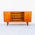Refinished Scandinavian teak sideboard / credenza on tapered legs, made in Denmark c. 1960s. At 79" wide and 42" high, it...