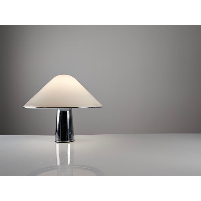 Designed in 1968, this is the largest version of the Elpis table lamp manufactured by Guzzini. The construction features a...