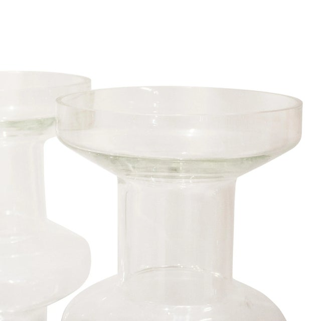 Cylindrical vase with geometrical shape made of transparent glass in the style of Ettore Sottsass. This piece is designed...