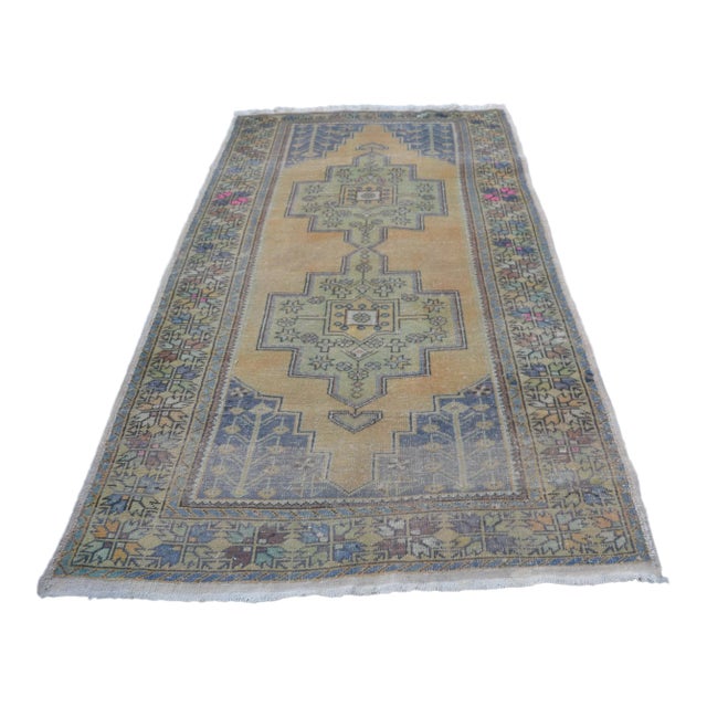 Faded Vintage Wool Turkish Rug - 4′6″ × 8′7″ For Sale
