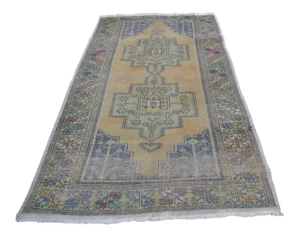 Faded Vintage Wool Turkish Rug - 4′6″ × 8′7″