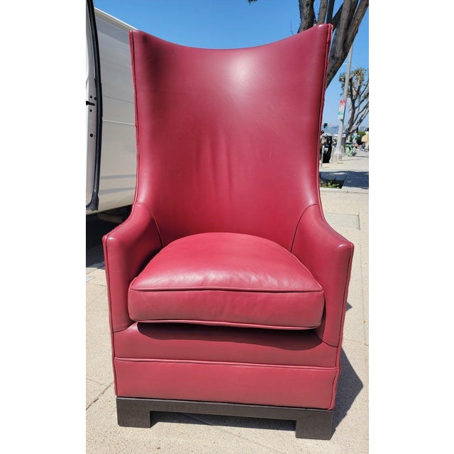 20Thc Mid century custom made red leather chair with died red cow skin backing. This is a custom made leather chair.