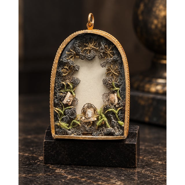 Rare antique reliquary pendant dating from the late 17th to early 18th century, preserved in a finely worked gilt-brass...