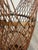 Vintage bamboo Ikebana basket features tall cylindrical shape with prominent rounded handle. The basket is woven of thin...