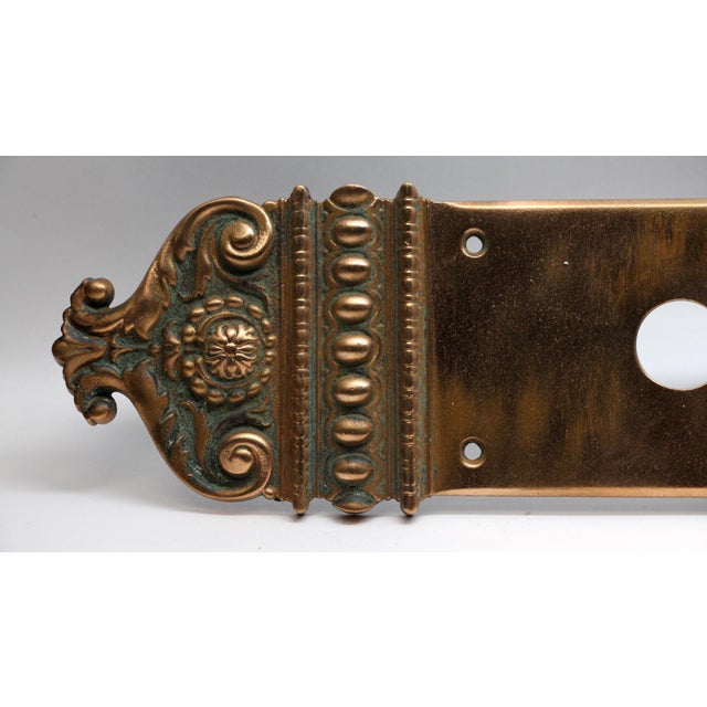 Classic style bronze entry door back plate made by Russell & Erwin in the 1895 catalog. It is part of the Normandie Dedham...