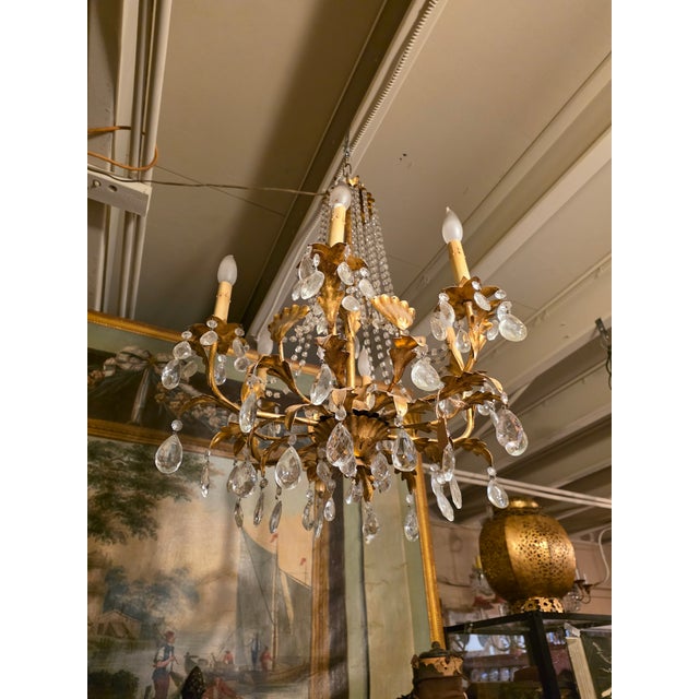 Beautiful vintage Gilt metal Italian chandelier with gold metal leaf details and macaroni beads.