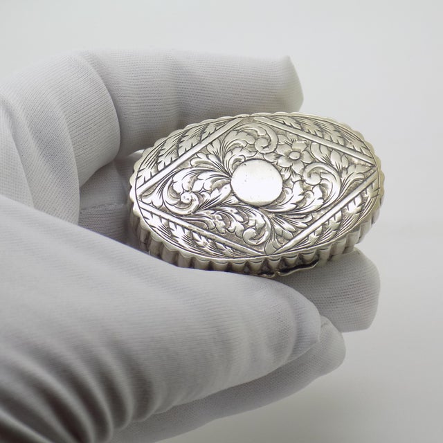 A refined example of mid-century italian silversmithing, this vintage oval trinket box is meticulously crafted from solid...