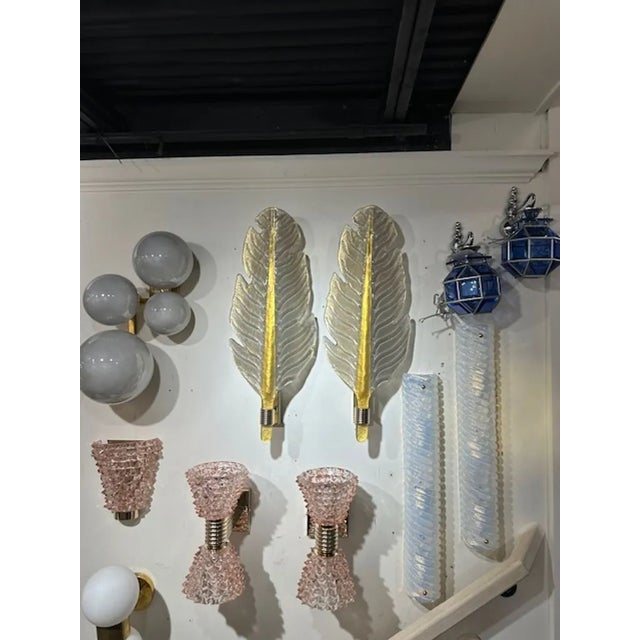 Great pair of modern Murano platinum and gold leaf form sconces. The sconces have been professionally rewired and ready to...