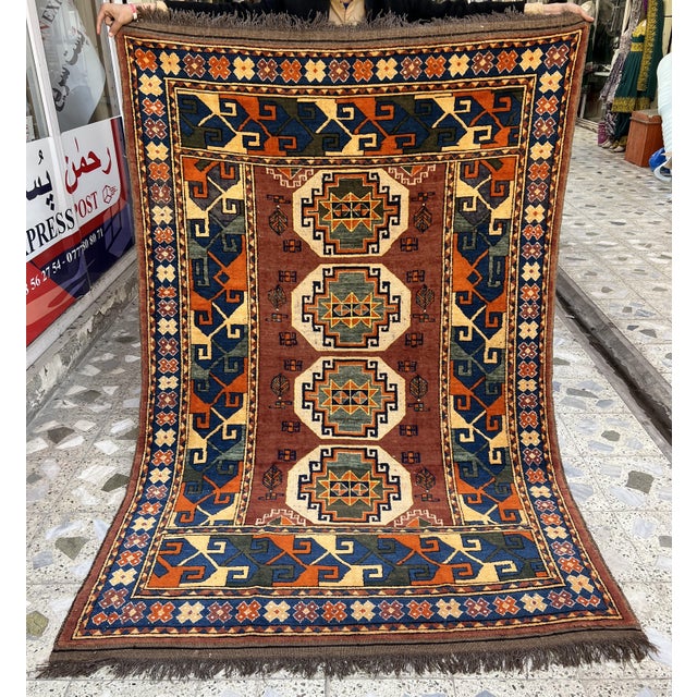 Antique-style Caucasian Lori Pambak Kazak rug featuring four bold octagonal medallions with eight-pointed star centers in...