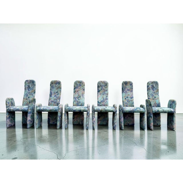 Set of six vintage Postmodern dining chairs with a really fun, unusual shape and colorful abstract upholstery. The set...