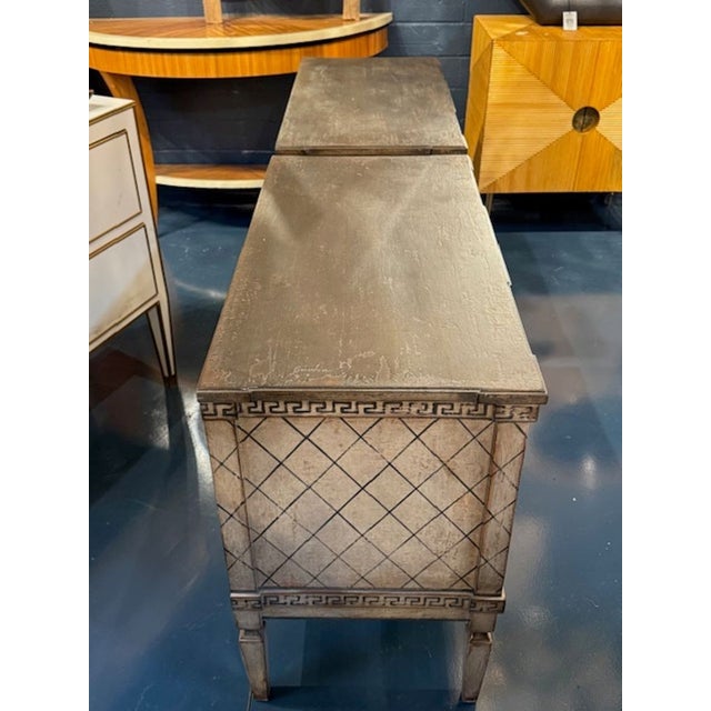 Good pair of German Neo-Classical hand painted bed side tables. Each pair is a conversation piece—ideal for flanking a...