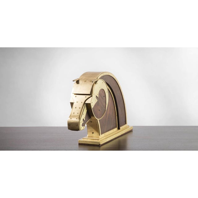 This stunning horse head is hand made of walnut and bronze. The measurements are 19” long x 11.75” tall x 4 deep.