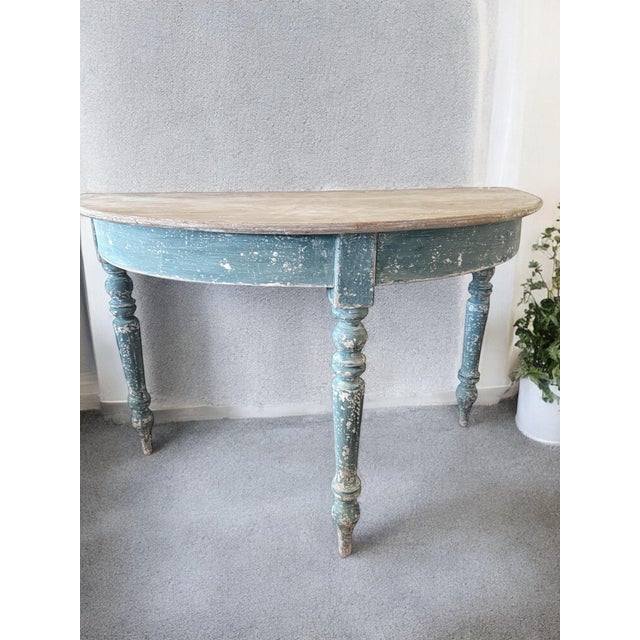 Absolutely stunning antique pair of demilune tables just in from France. Desirable aged patina of French blue and gray...