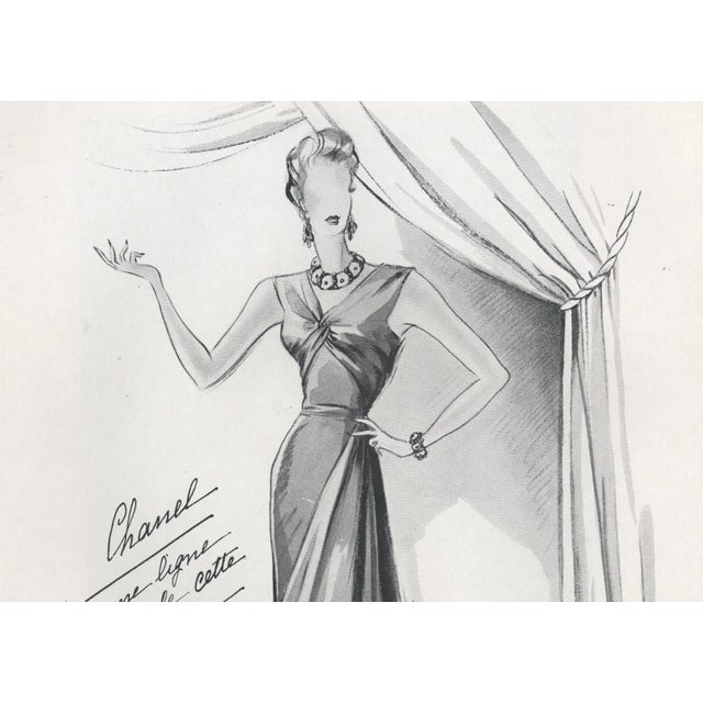 This is a CHANEL French fashion design print that dates to 1939. It originally came from a haute couture magazine from...