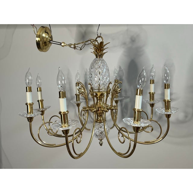 Vintage 8 light cut crystal and brass pineapple chandelier with brass canopy and sleeve caps. This elegant, bright...