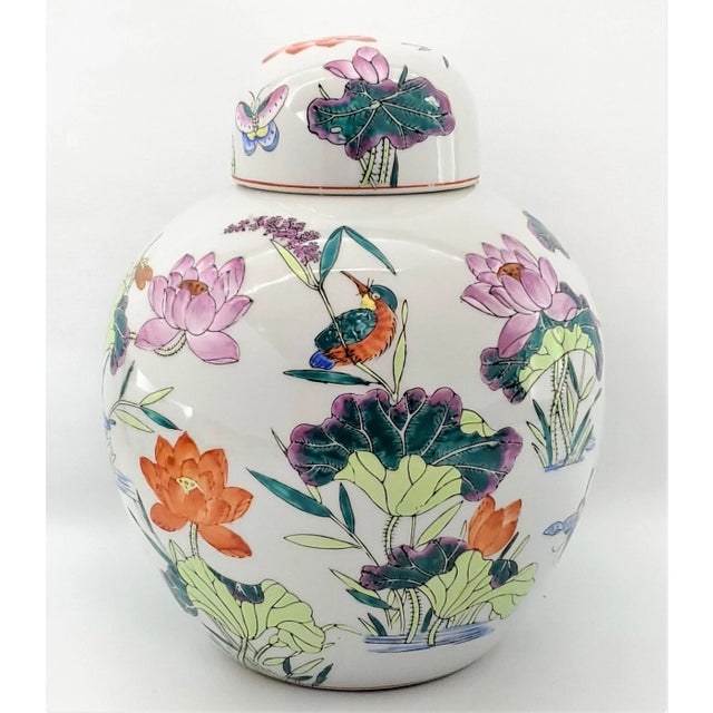 Offering a gorgeous vintage Chinese white porcelain ginger jar covered in traditional Chinese symbols, circa Mid 20th...