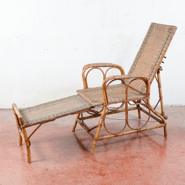 This charming Art Nouveau lounge chair is a refined example of early 20th-century outdoor or conservatory furniture. The...