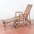 This charming Art Nouveau lounge chair is a refined example of early 20th-century outdoor or conservatory furniture. The...